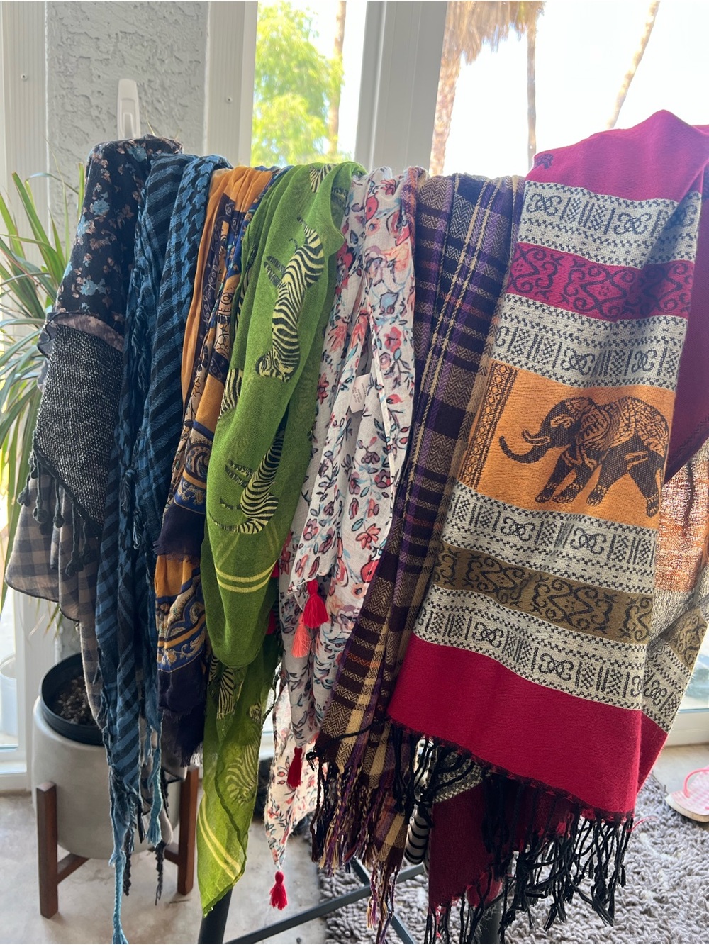Eight scarves of various colors and styles